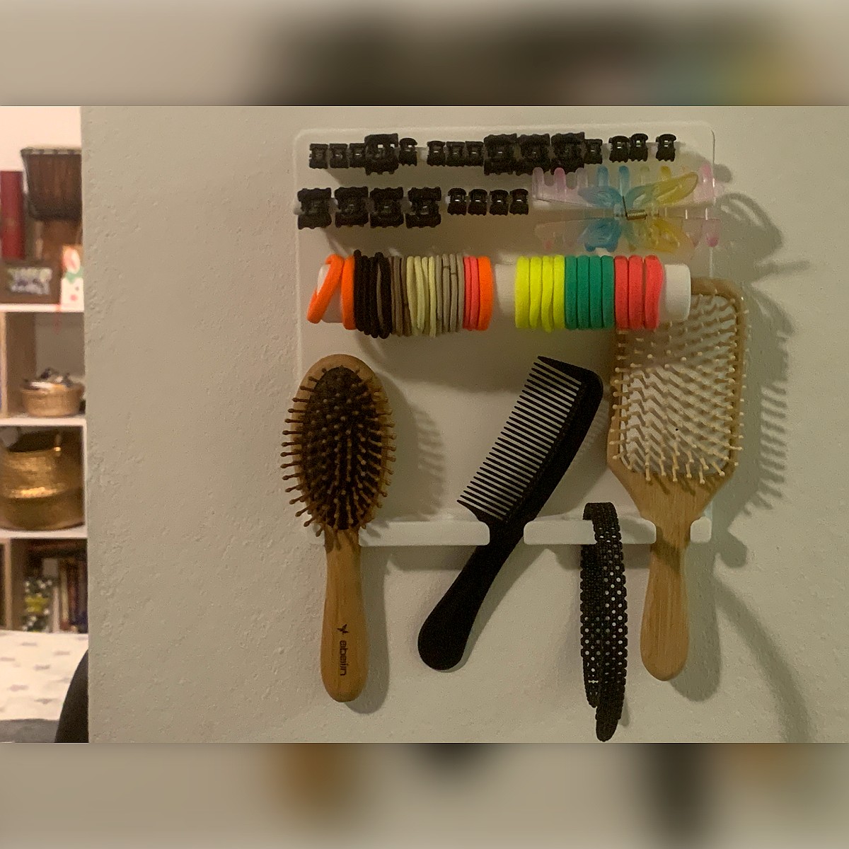 Organizador de pared para accesorios de pelo